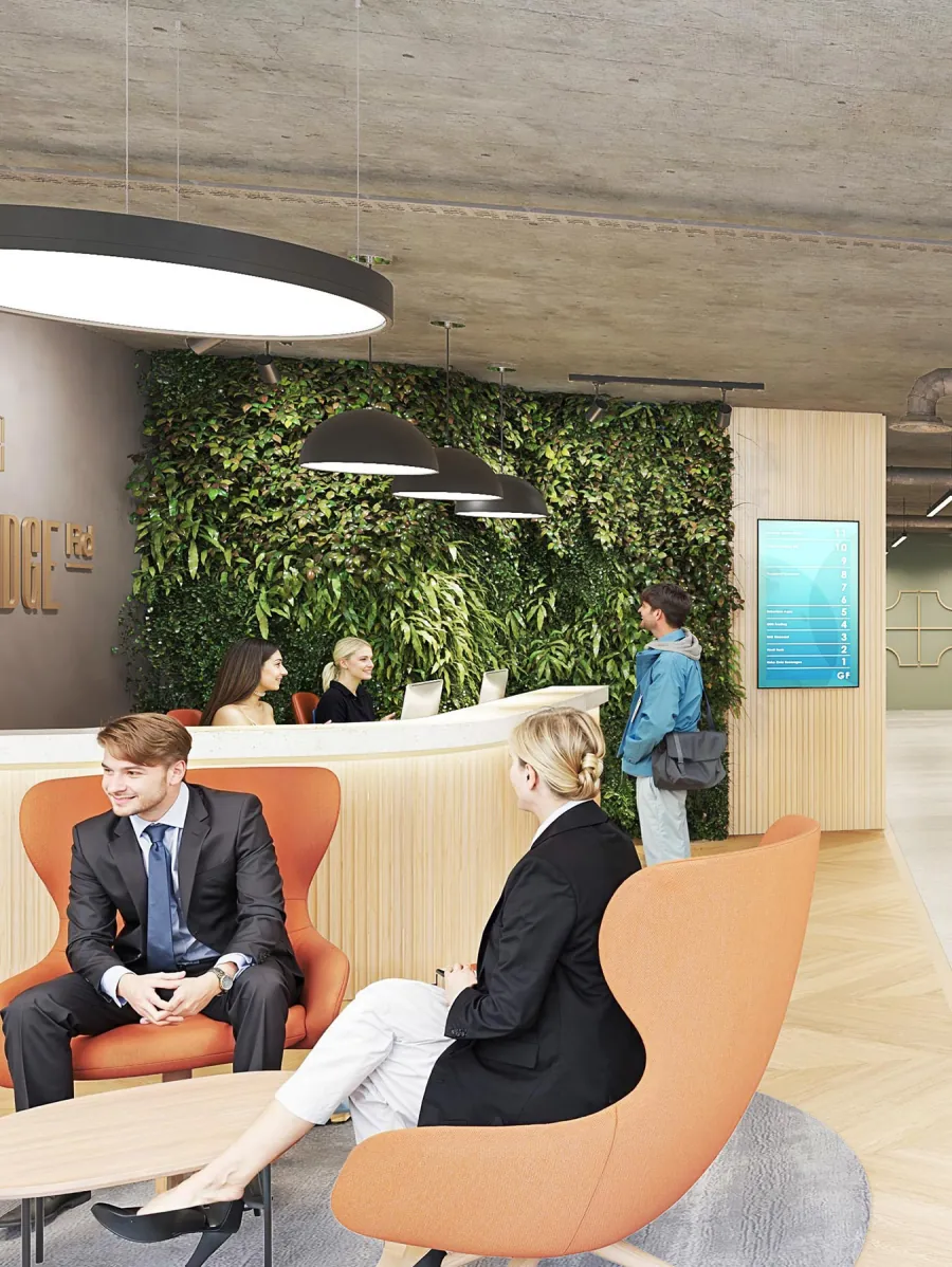 CGI of the reception with orange armchairs and a living green wall